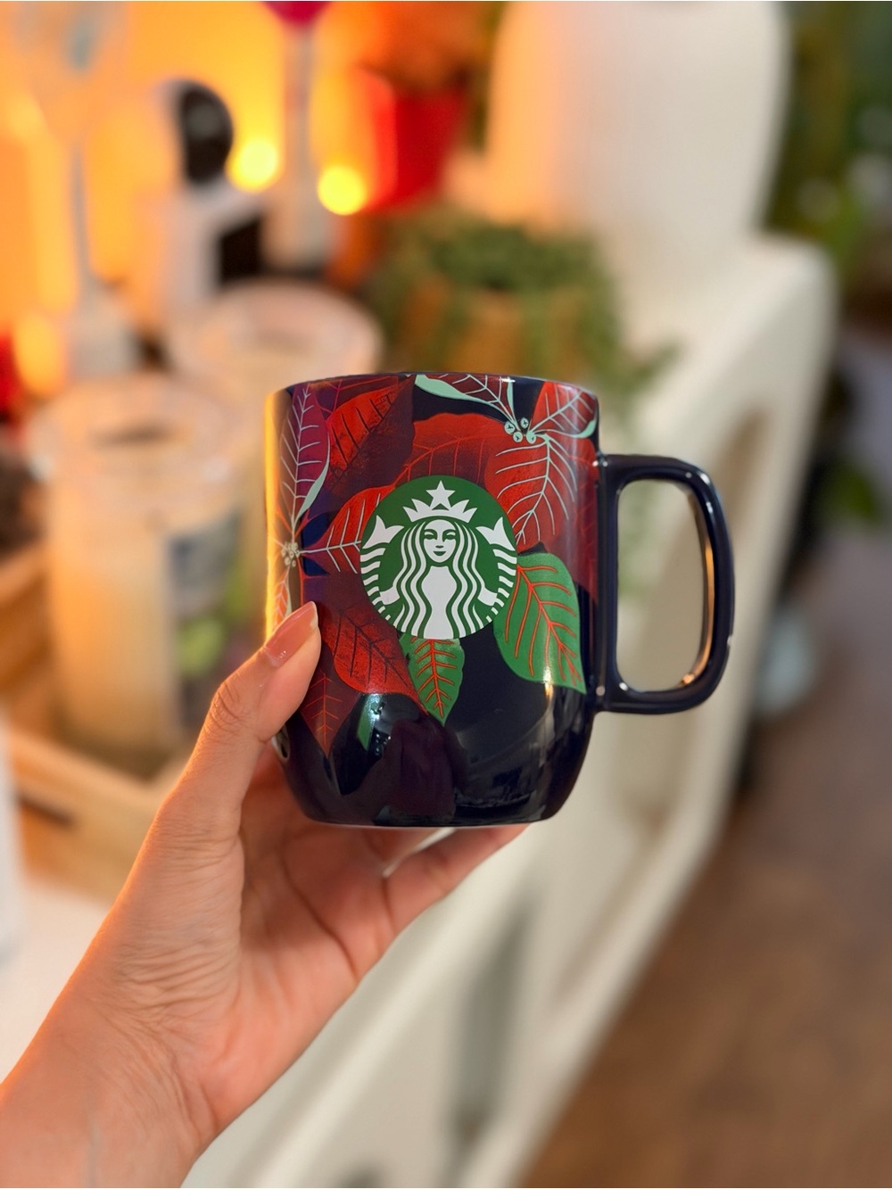 Starbucks 12 oz ceramic dark Navy Mug with Red and Green Leaf Motif and logo